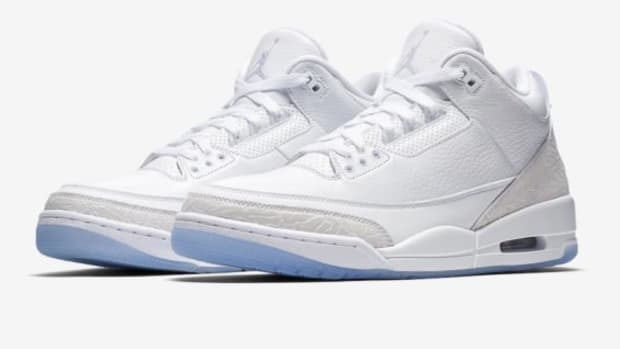 View of white and grey Air Jordan shoes.